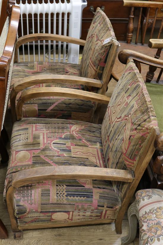 A pair of Art Deco upholstered armchairs